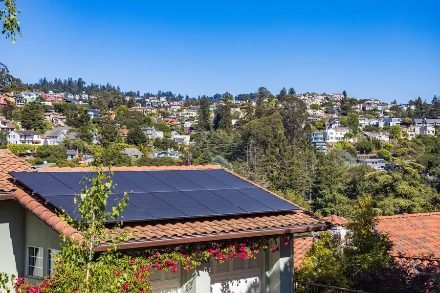 Perth house with rooftop solar panels generating electricity during the day