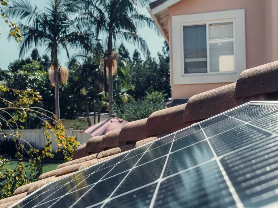 Rooftop solar panels on a west-facing roof catching afternoon sun
